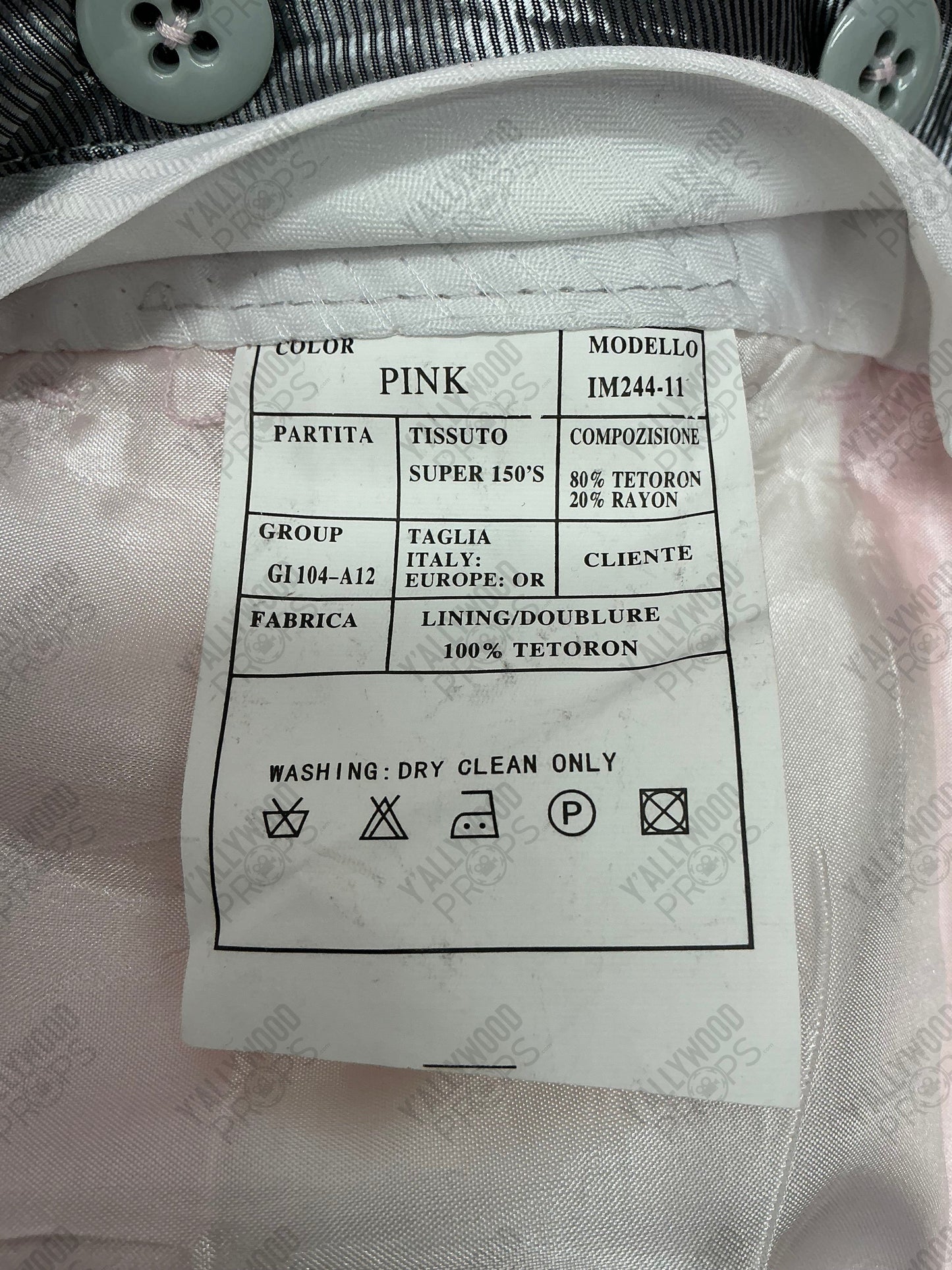 Care label for pink garment with tetoron and rayon blend fabric, showing dry clean only instructions and Italian manufacturer