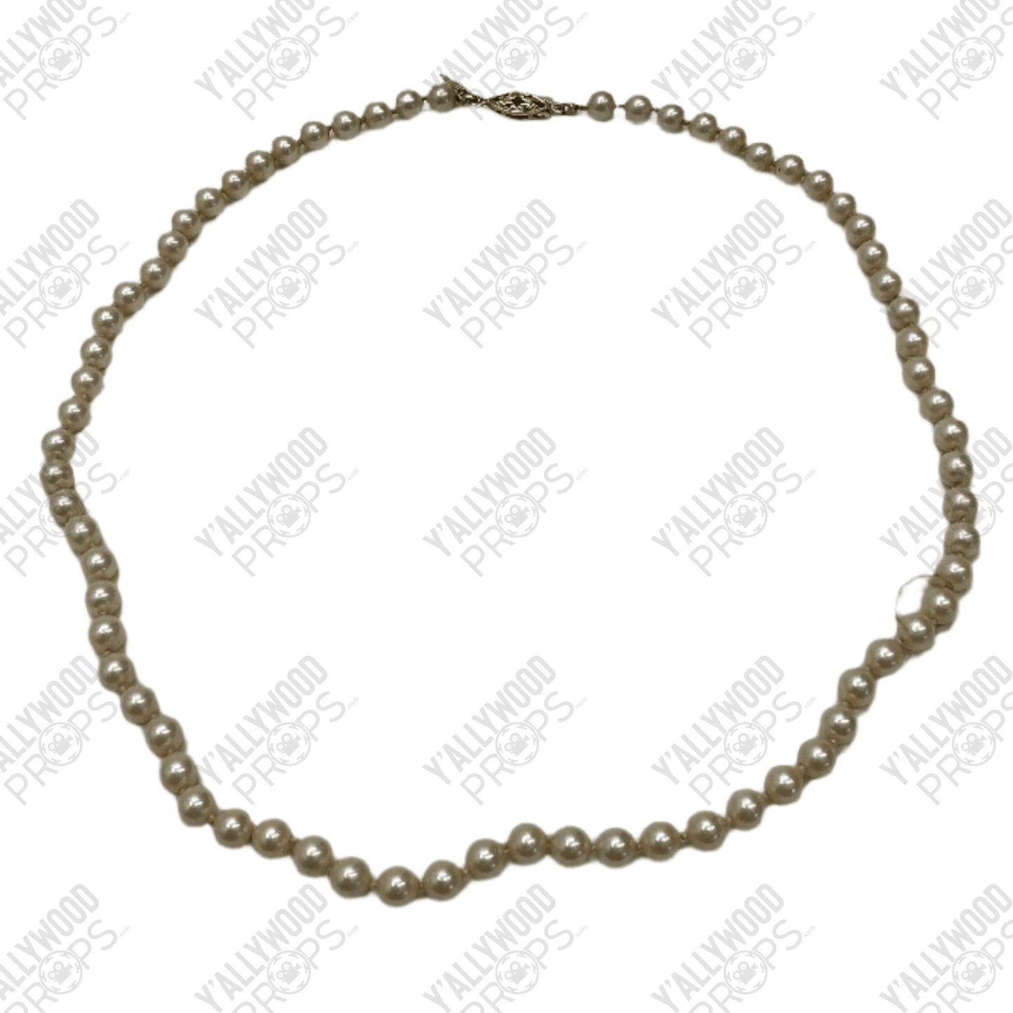 Cream-colored pearl necklace with metallic clasp and uniform round beads throughout.
