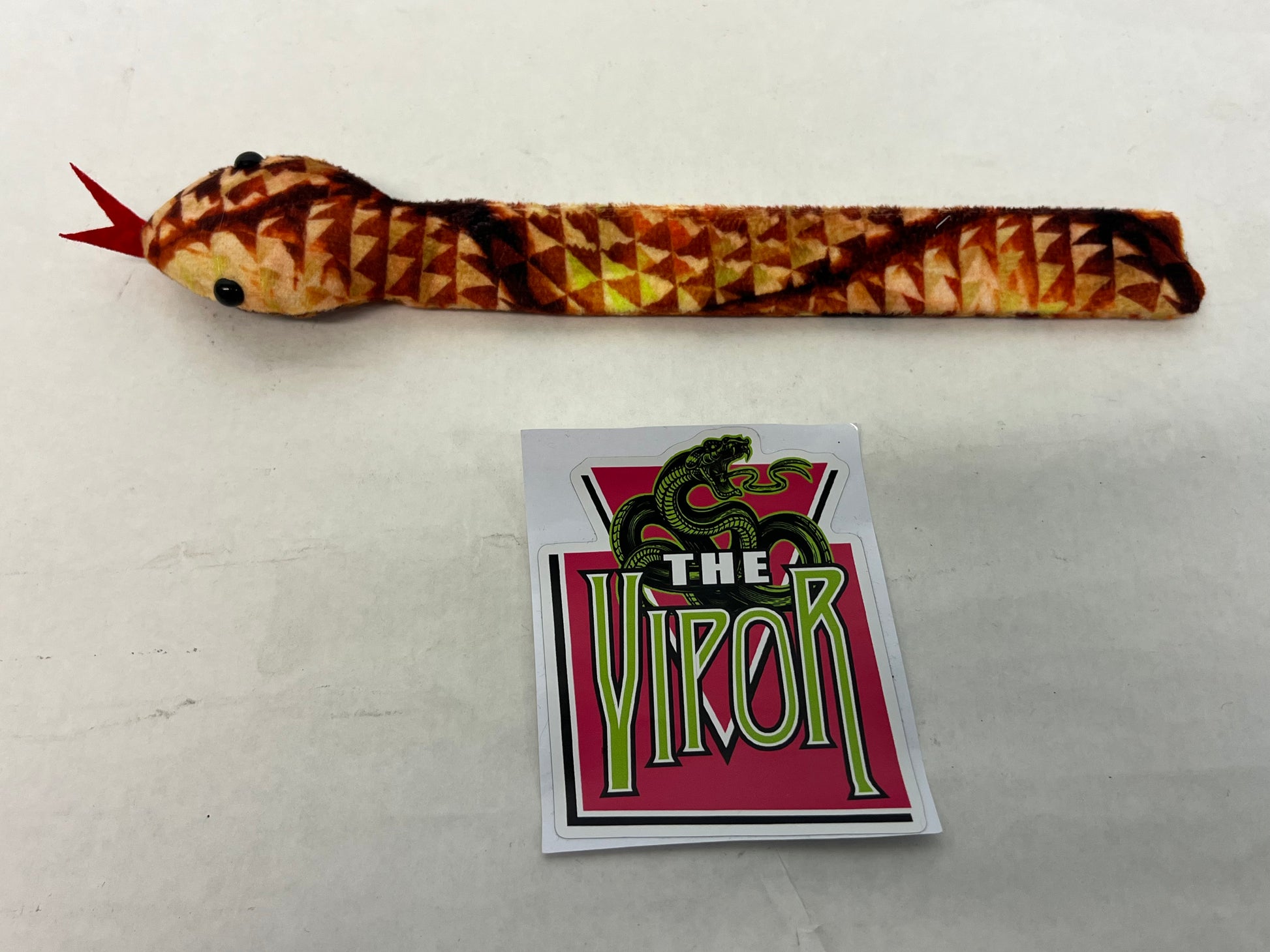 The Vipor Merch S2E4 Heels (2021) Movie Prop Atlanta Brick Co Orange slap bracelet A w/sticker  